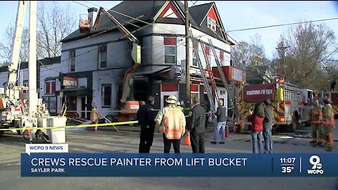 Crews rescue painter from lift bucket after fire