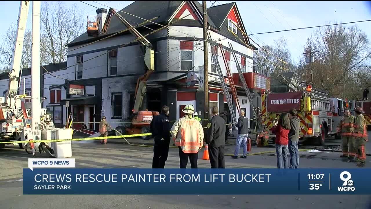 Crews rescue painter from lift bucket after fire