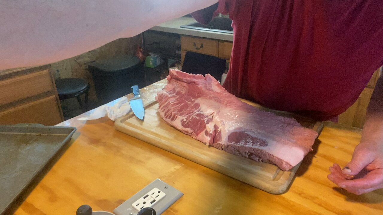 Trimming a brisket.