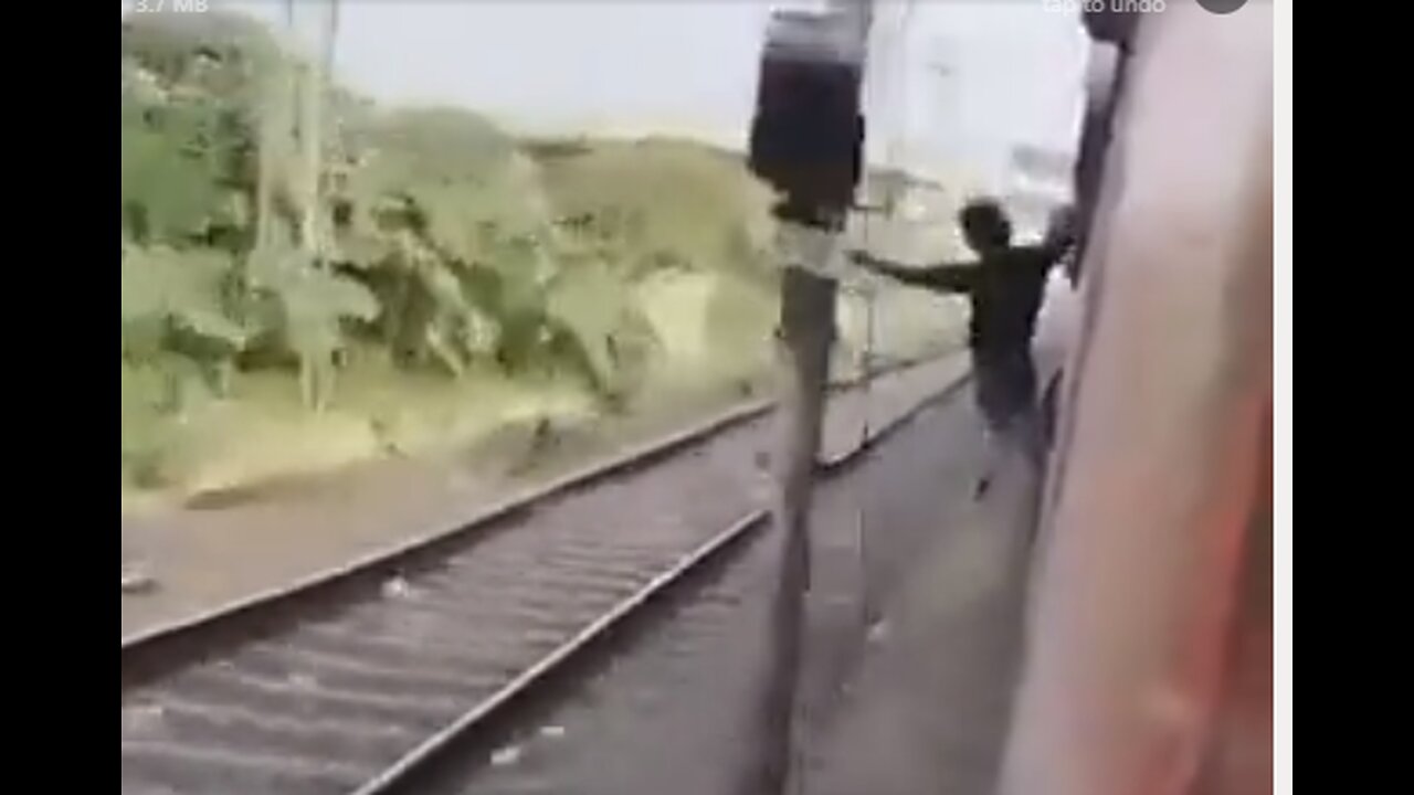 INDIAN GUY DIES AS HE WAS DANGLING OUT OF A TRAIN HIT BY A TRAIN POST