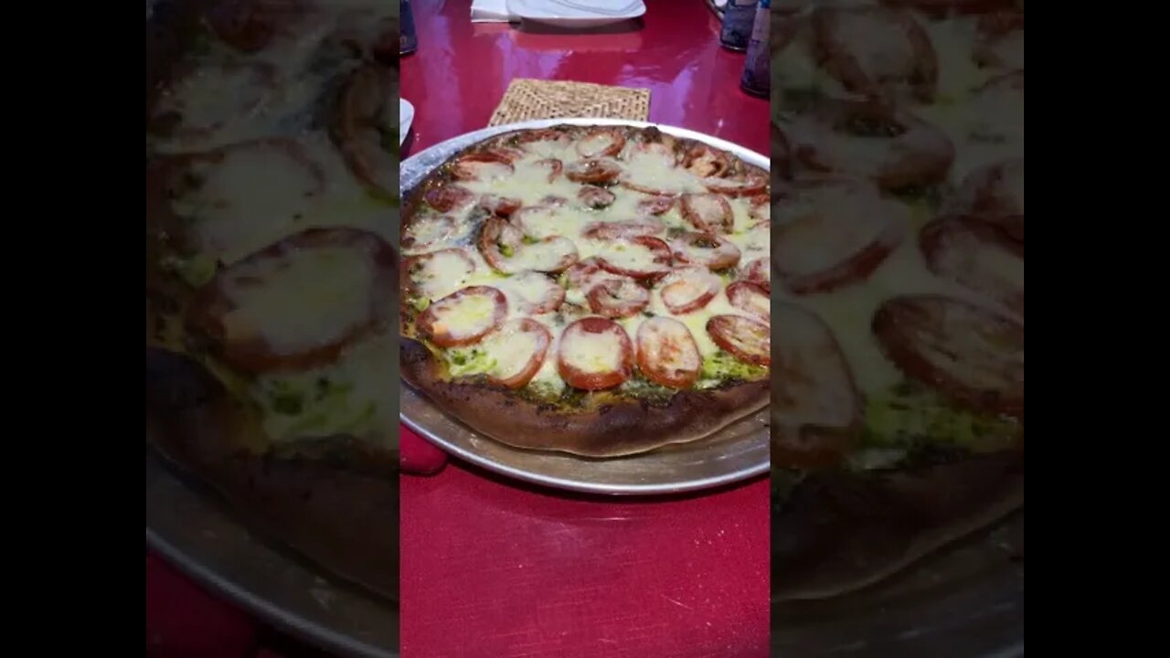 Homemade PIZZA! Basil pesto, Roma tomato from the garden and mozzarella cheese! Gonna be good eatin!