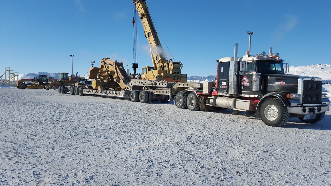 Ice Road Odyssey: Peterbilt Tractor Braving Elements En Route to Yellowknife