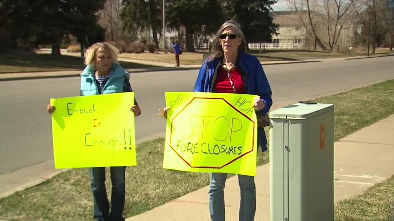 Protesters gather outside Green Valley Ranch HOA office following foreclosures