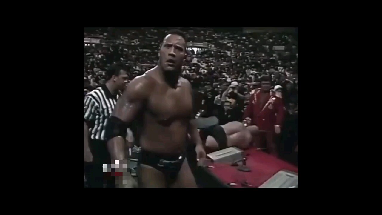 The Rock grabbing the videocamera then getting a Stone Cold Stunner