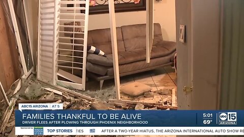 Driver crashes through Phoenix neighborhood before walking away from damage