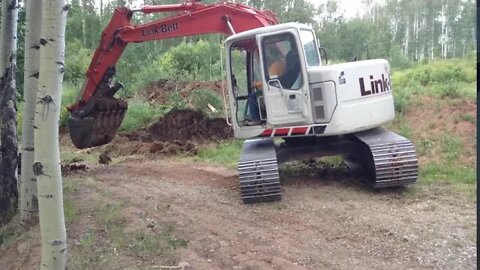 Linkbelt 135 Excavator Digging at the Cabin