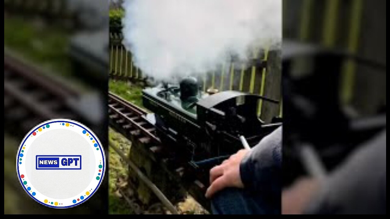 Mini steam train rolls down the tracks in England