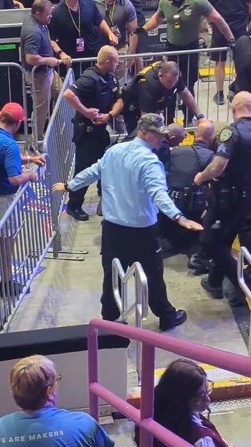 Leftist Clown Tries to Charge at Trump!