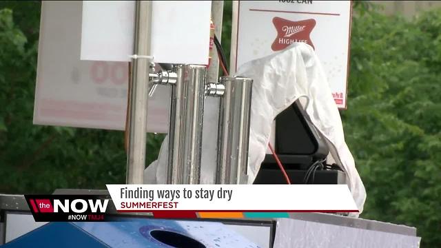 Patrons find ways to stay dry during soggy Summerfest opener