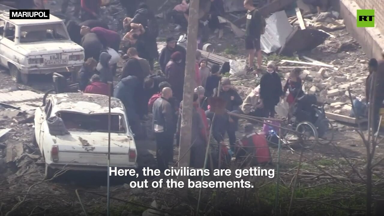 Evacuated civilians greet Russian troops and media after weeks in basements near Azov Steel plant