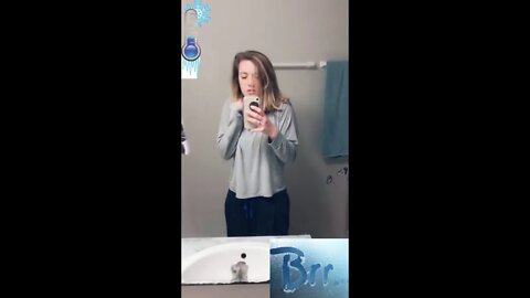 Cold bathroom. The girl is shivering from the cold and teeth chattering from the cold