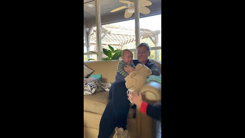 Laughing baby caused by the sister