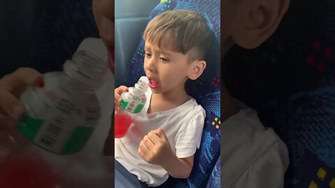 Baby boy has a new haircut and drinks his favourite drink in the bus