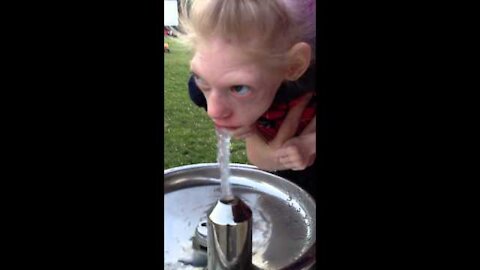 Lola drinking from a water fountain!