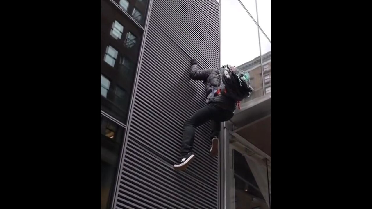Left Wing Protestor FALLS While Trying to Climb NYC Building