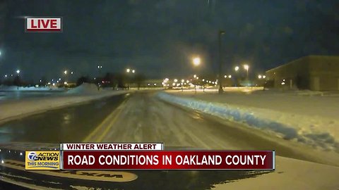 Snowy road conditions in Oakland County