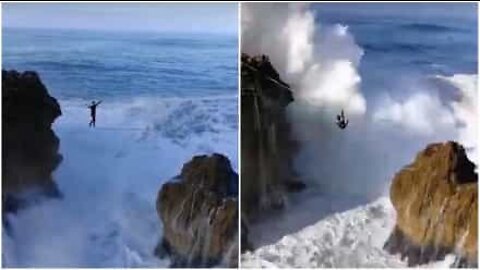 Man defies death slacklining over giant waves in Portugal