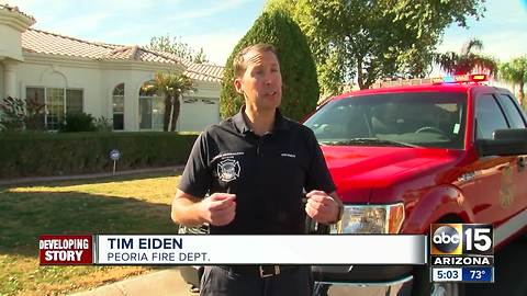 Peoria family OK after accidentally leaving car running