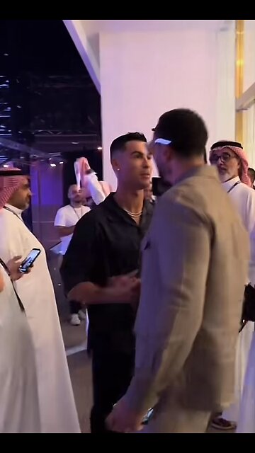 Cristiano Ronaldo greets Rio Ferdinand