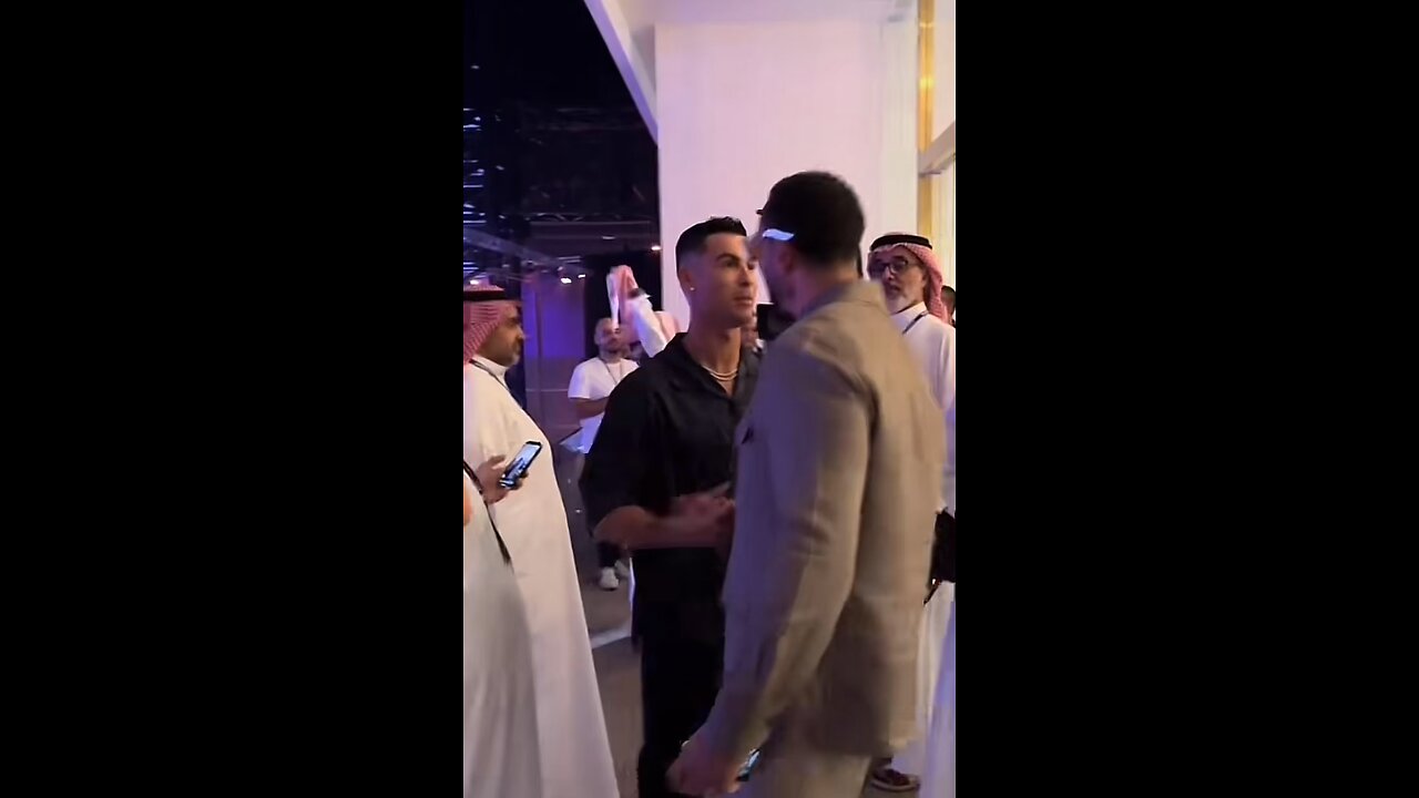 Cristiano Ronaldo greets Rio Ferdinand