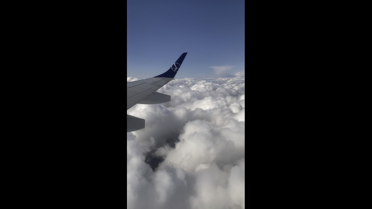 A Plane Gliding Through Dreamy Fairyland Clouds