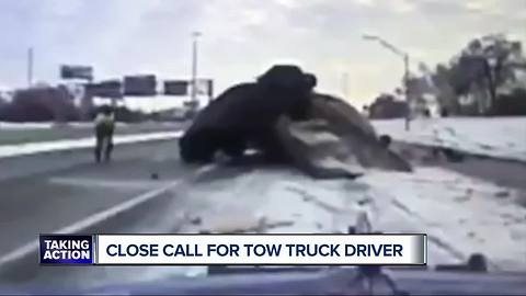 Wild dashcam video shows car slam into tow truck on Detroit freeway