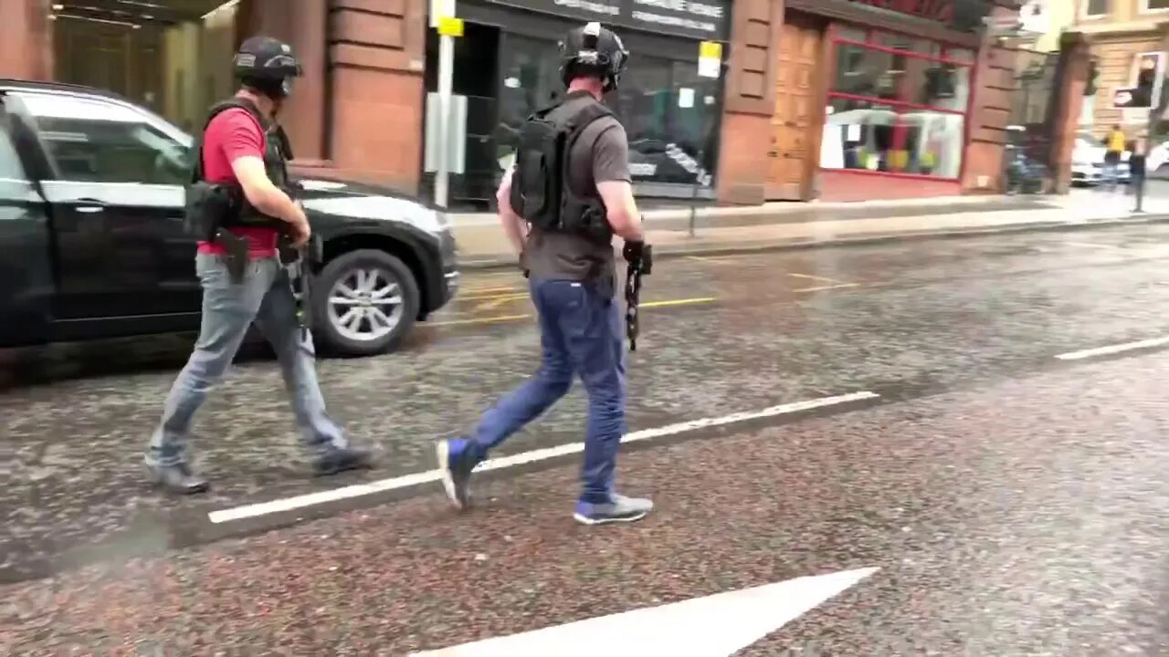Armed police arrive in Glasgow city centre to secure location after suspected terrorist shot dead