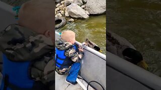Outdoor Johnny hand feeding a duck. That laugh