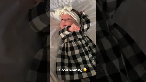 Cute adorable baby child with warm white and pink hat with cute baby girl
