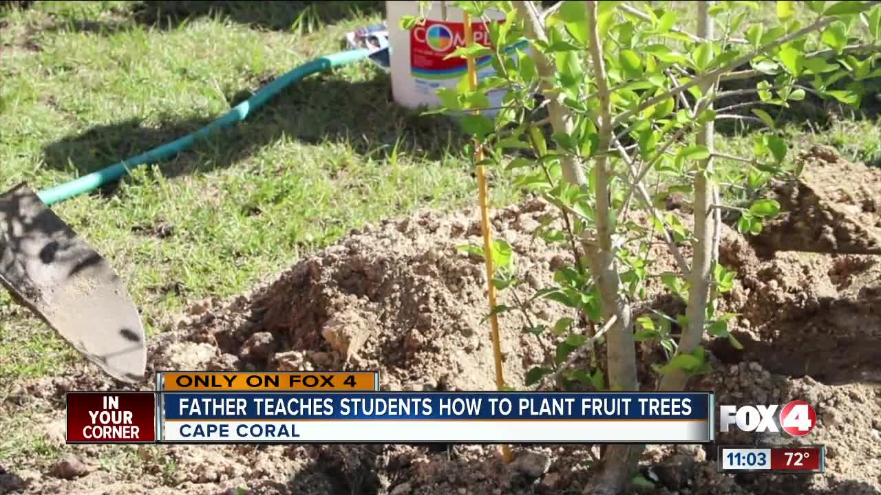 Father teaches students hot to plant fruit trees