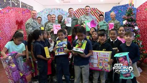 "Santas in Blue" donate Christmas gifts to Tucson kids