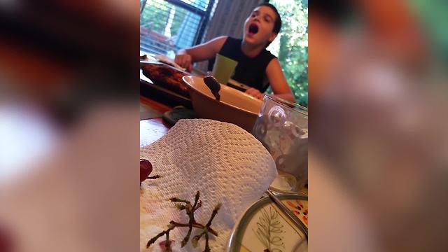 Boy Tries To Catch Blackberries In His Mouth