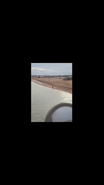 Russian helicopter pilot is welcomed by a person with the Soviet flag