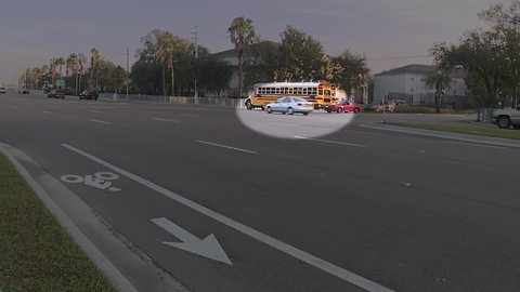 Caught on video: Car speeds past stopped school bus in Fort Myers