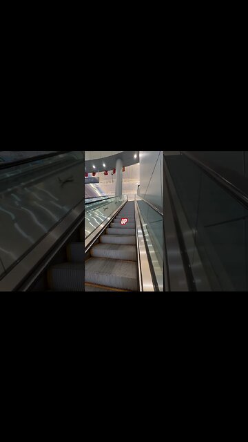 Up Escalator at Harry Reed international Airport, Las Vegas ￼D GATES