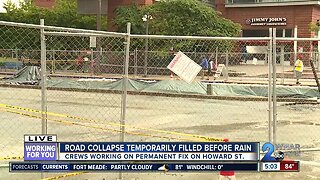 Road collapse temporarily filled before rain