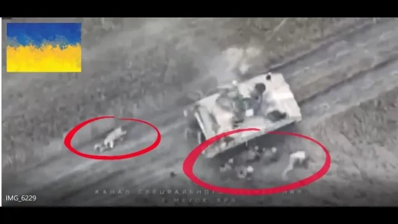 Watch Ukrainian soldiers crawl out of burning vehicle, Russian artillery.