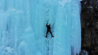 Mountaineers climb frozen waterfall