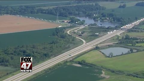 Man in custody after police chase, standoff shuts freeway