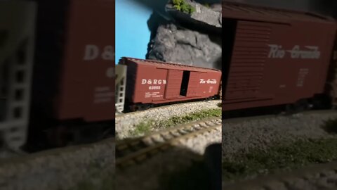 N Scale heavy pacific struggling up a hill.