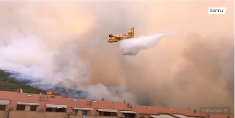 Firefighters struggle to tame Sardinian wildfire as blaze rips through the island