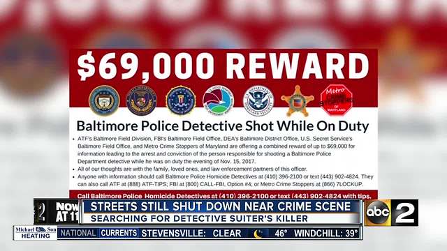 Police continue to search for gunman after Baltimore detective shot