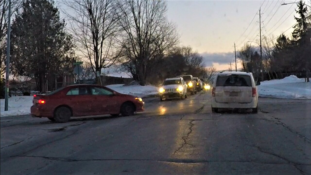 Road rage ensues after angry woman makes improper left turn then gets hostile