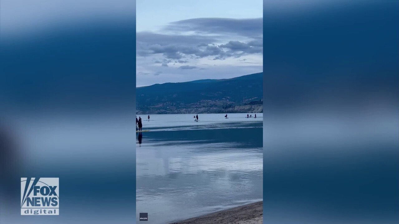 Group Of 'Witches' Paddle Across Lake In Odd Moment Caught On Camera