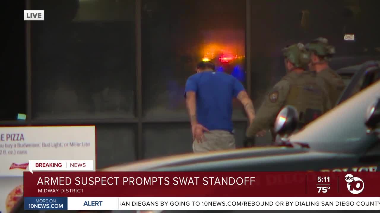 Armed suspect surrenders after Midway District standoff