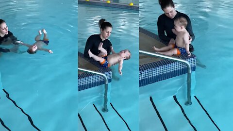 10 month old baby during 4th week of Infant aquatics class - fall backwards challenge