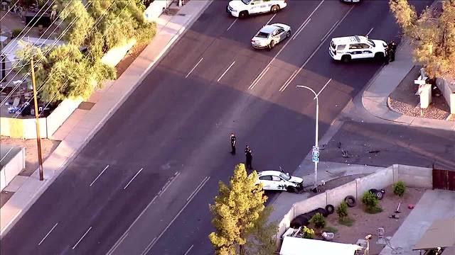 Police say a man with a gunshot wound crashed into a car near 51st Ave and McDowell and is in extremely critical condition