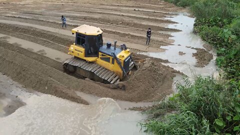 We fill up the lake with a powerful bulldozer.