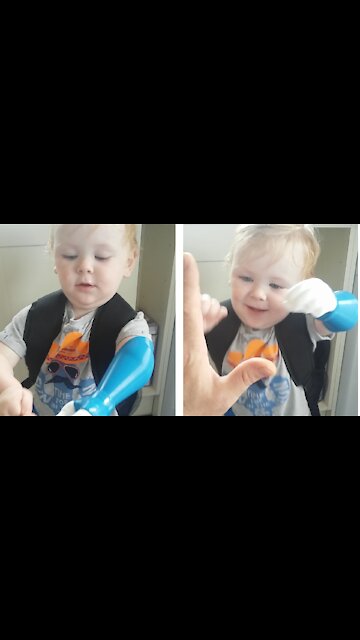 Cute little lad gives dad a high 5