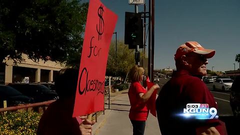 Teachers and parents paint Ina Rd. Red for Ed